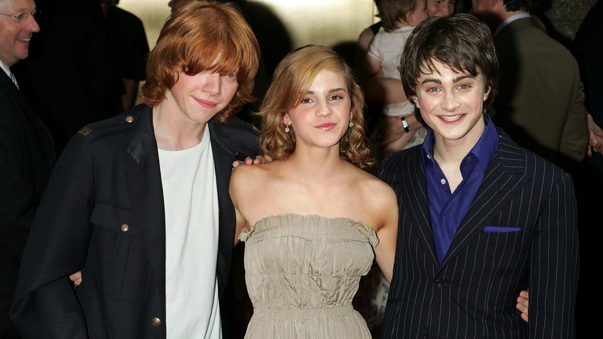 Rupert Grint, Emma Watson, and Daniel Radcliffe pose at the premiere of the Prisoner of Azkaban in 2004.