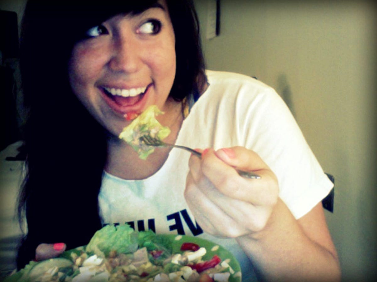 Fans of the Women Laughing Alone With Salad submit photos of themselves having a chuckle while chomping on veggies.