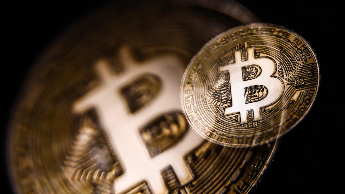 An image of a gold coin representing bitcoin.