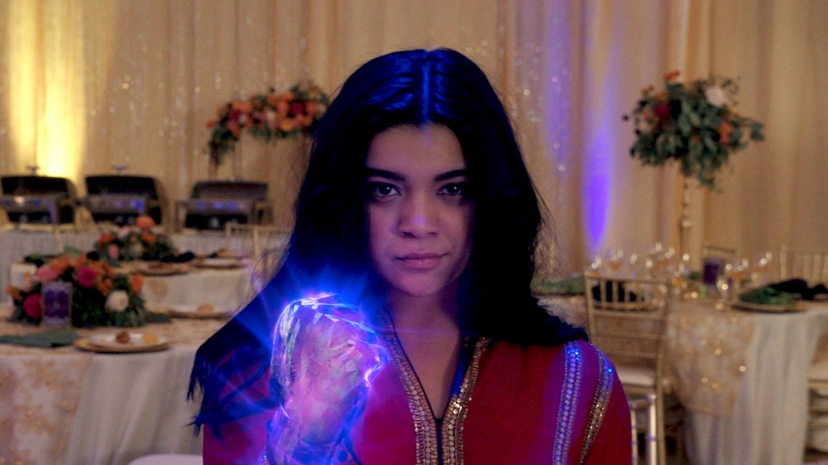 Alone at a wedding, Kamala Khan shows her superpowered glowing fist.