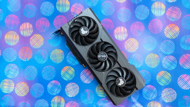 The Asus TUF GeForce RTX 4070 Ti OC lying fans up on a multicolor background