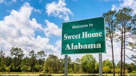 Welcome to Sweet Home Alabama road sign along Interstate 10 in Alabama, near the state border with Florida.
