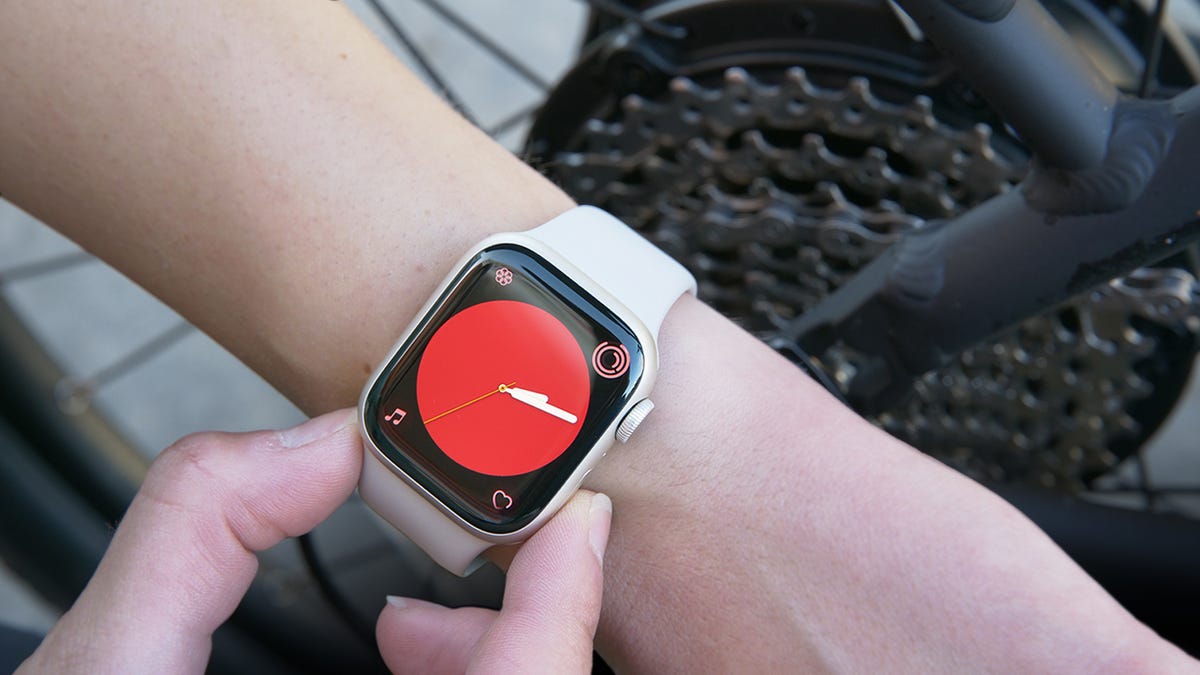 Apple Watch with a red watch face
