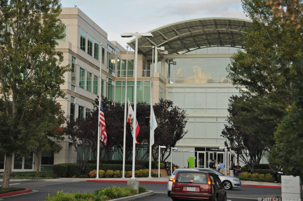 Flags fly at half mast at Apple's headquarters in Cupertino, Calif.