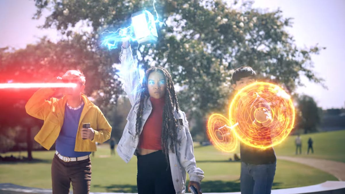 Three people with superpowers out in a public park