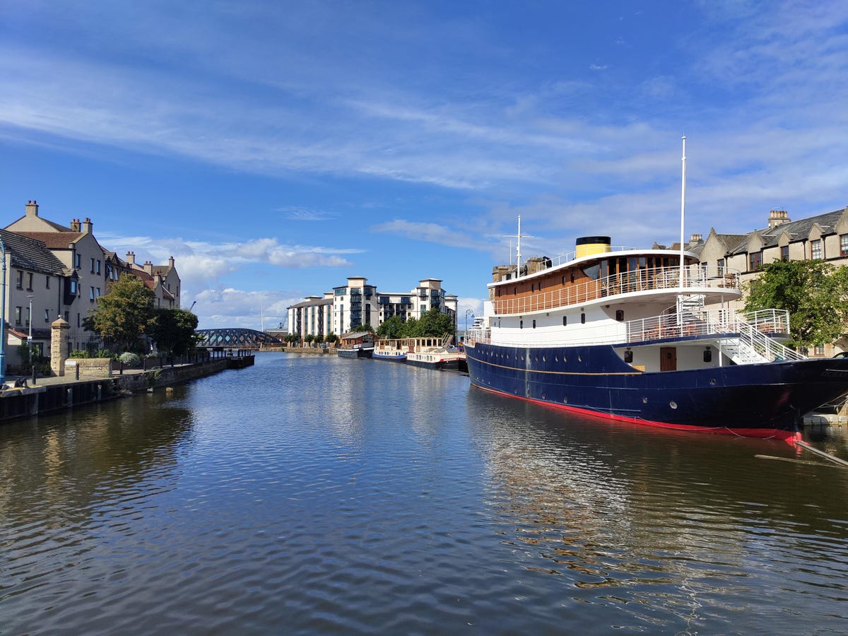 daytime photo of a ship on a canal