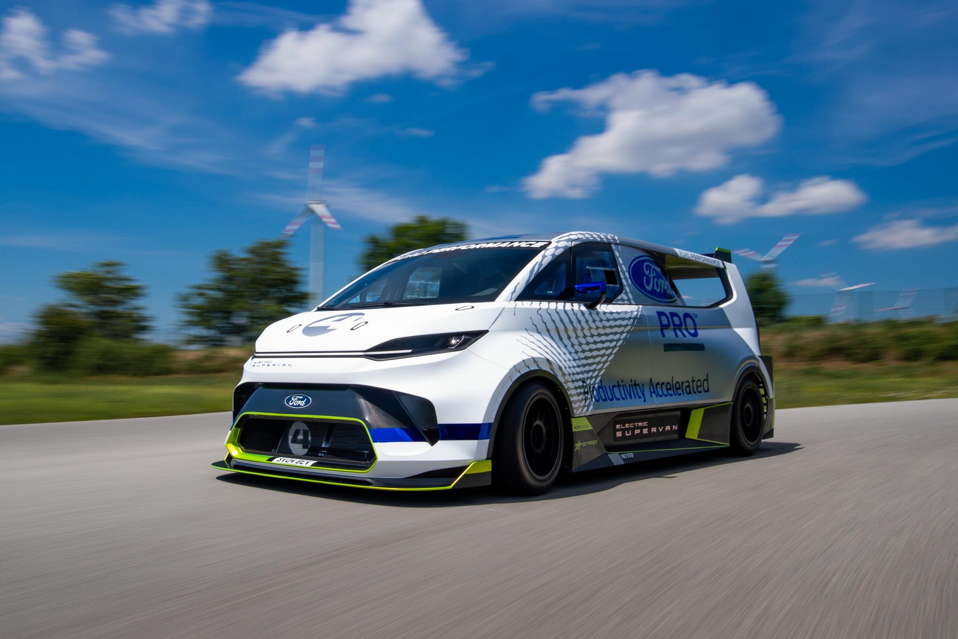 Ford Pro Electric SuperVan Transit race car in motion outdoors