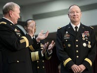 Chairman of the Join Chief of Staff Army General Martin Dempsey (L) and others clap for General Keith B. Alexander during a retirement ceremony at the National Security Agency March 28, 2014 in Fort Meade, Maryland. US Secretary of Defense Chuck Hagel attended the event to mark the retirement of General Keith B. Alexander from the US Army and as head of the National Security Agency, the Central Security Service and U.S. Cyber Command. AFP PHOTO/Brendan SMIALOWSKI        (Photo credit should read BRENDAN SMIALOWSKI/AFP/Getty Images)