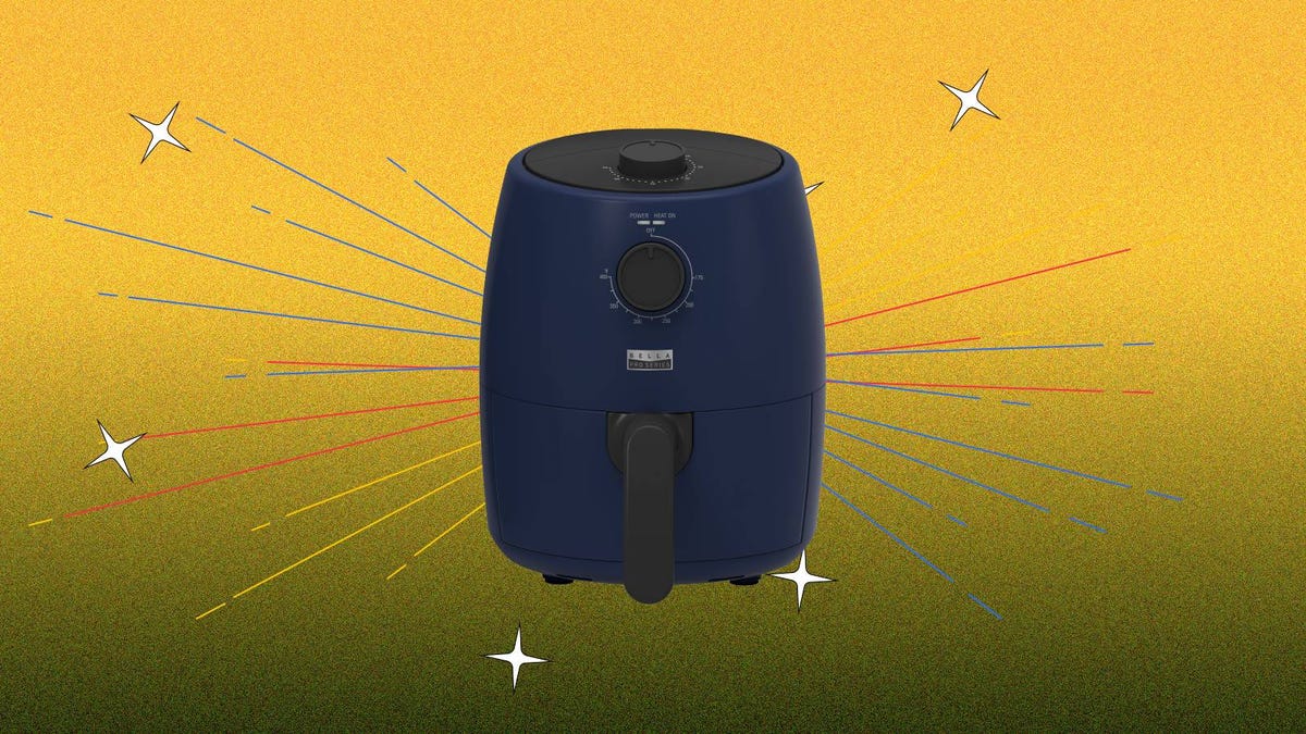 A blue 2-quart analog air fryer in matte ink blue rests against a yellow background.
