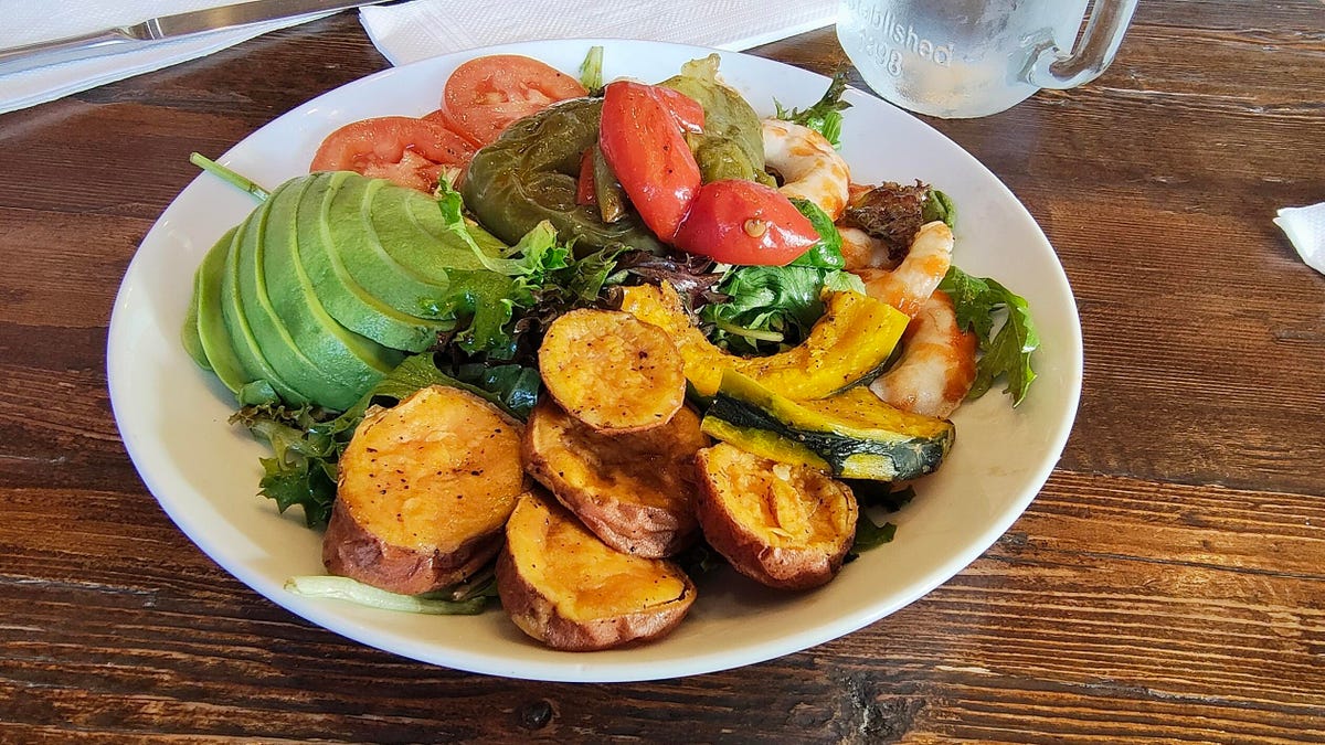 A salad with avocado, tomatoes, toasted squash and vegan shrimp (it was fine, but not great).