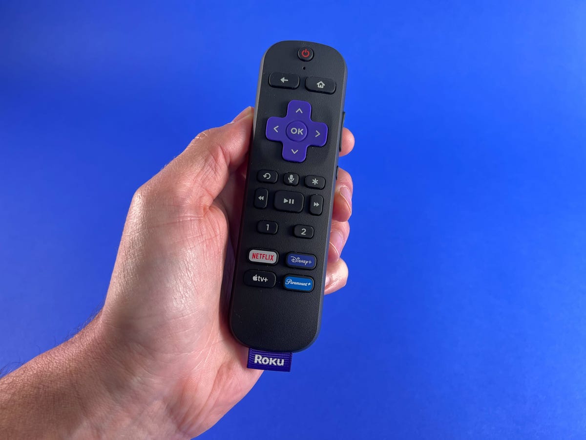 Roku Ultra 2022 Voice Remote Pro held in a hand