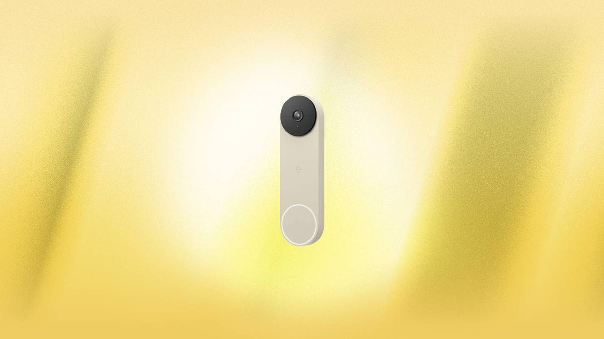 A Nest video doorbell against a yellow background.