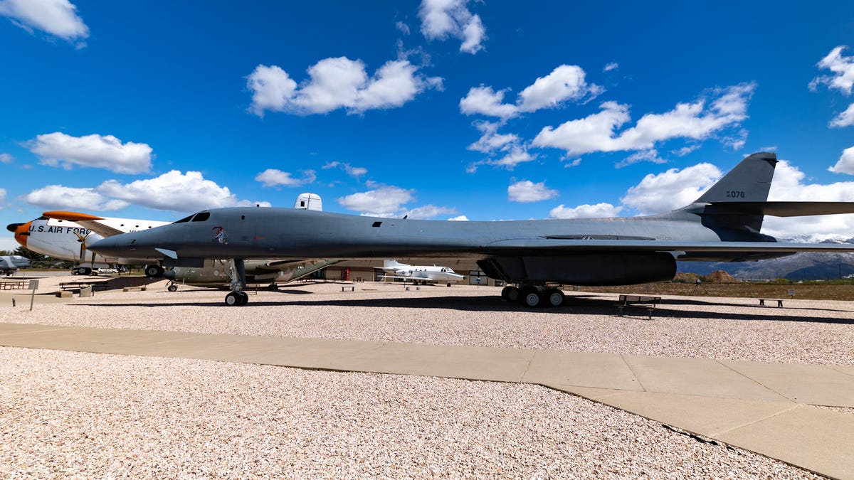 A side-view of the B-1 under a bright blue sky.