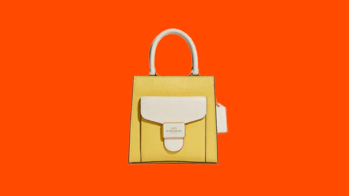 Close up of a yellow Coach Outlet handbag