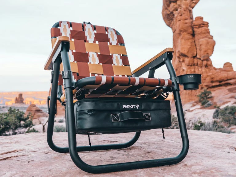 chair with cooler hanging below on rock formation
