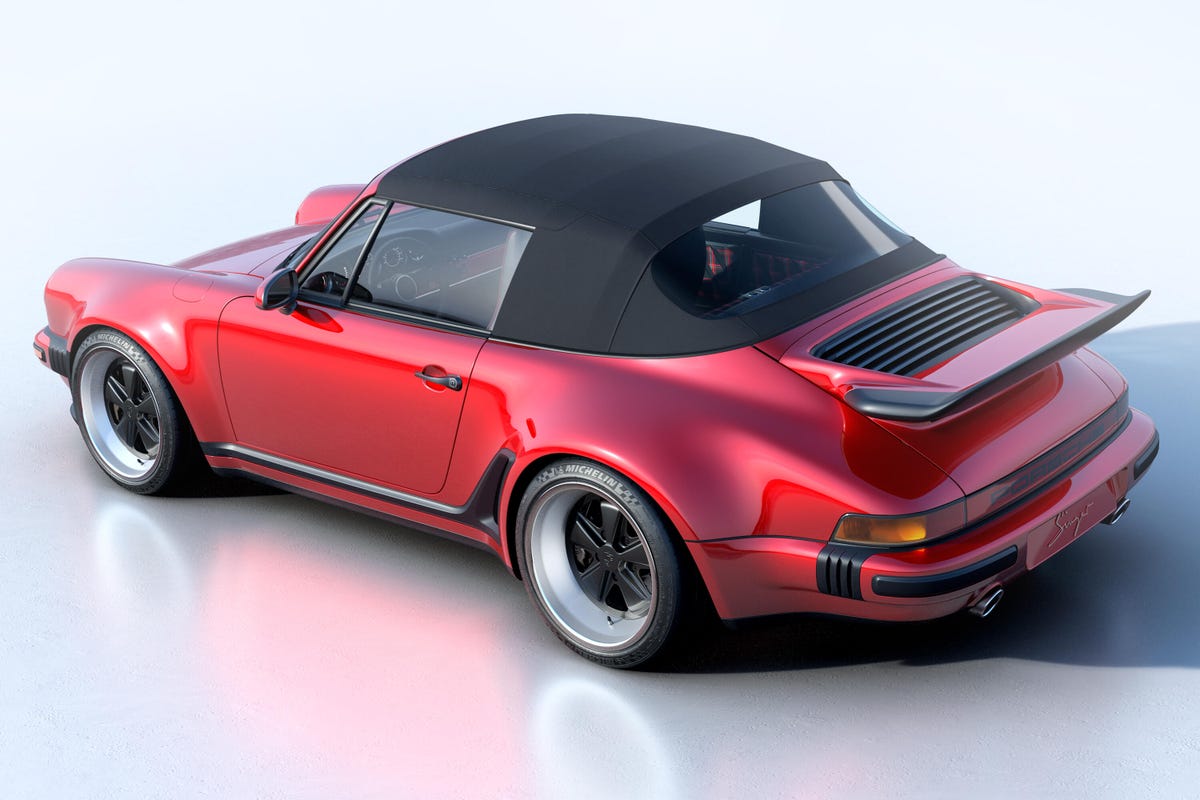 Rear 3/4 view of a red Singer Reimagined Porsche 911 Turbo Study Cabriolet