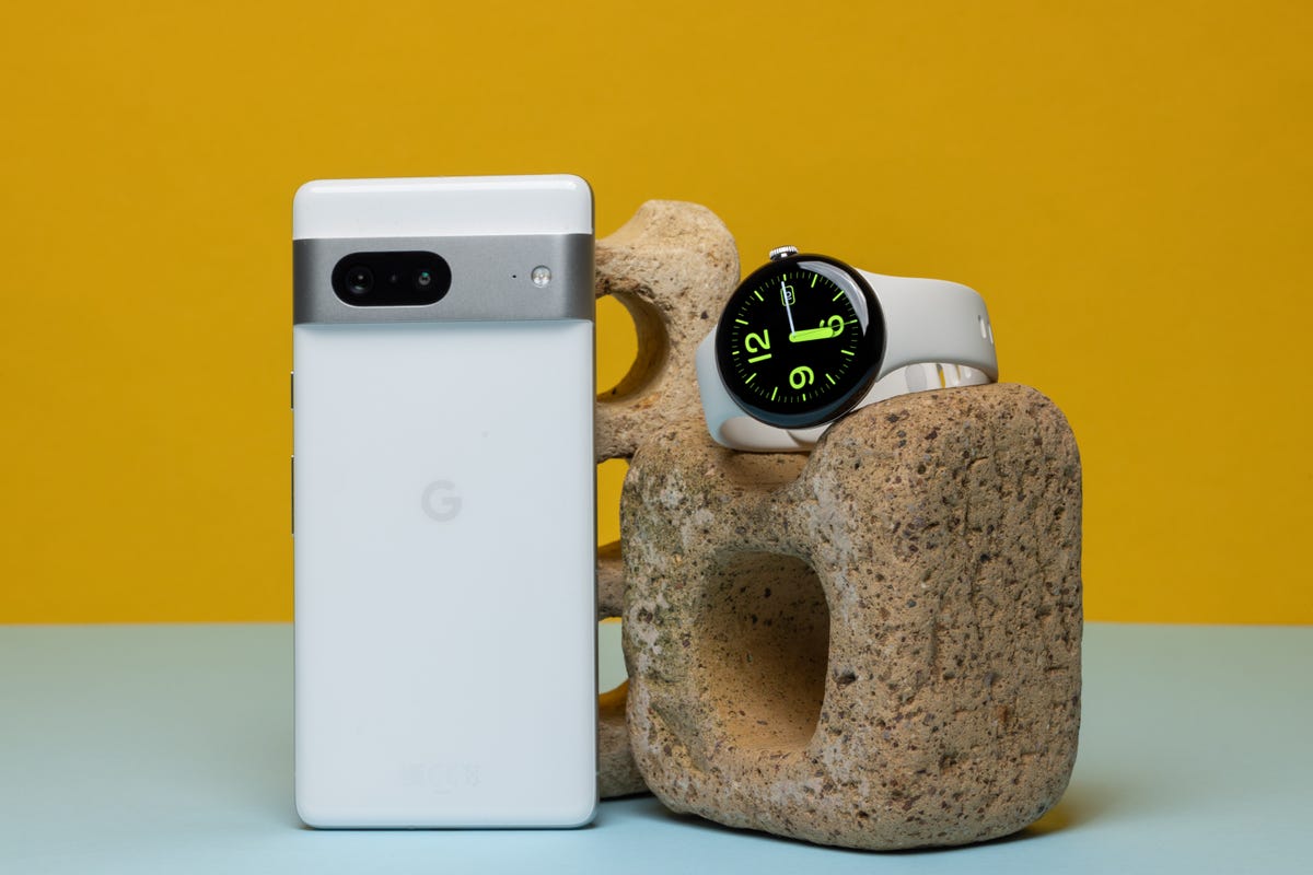 The Pixel 7 pictured next to the Pixel Watch against a yellow background