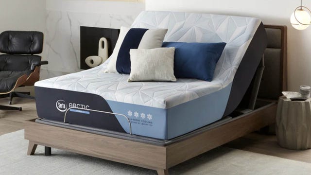 This is a photo of a bedroom featuring the Serta Arctic Hybrid Mattress on an adjustable base.