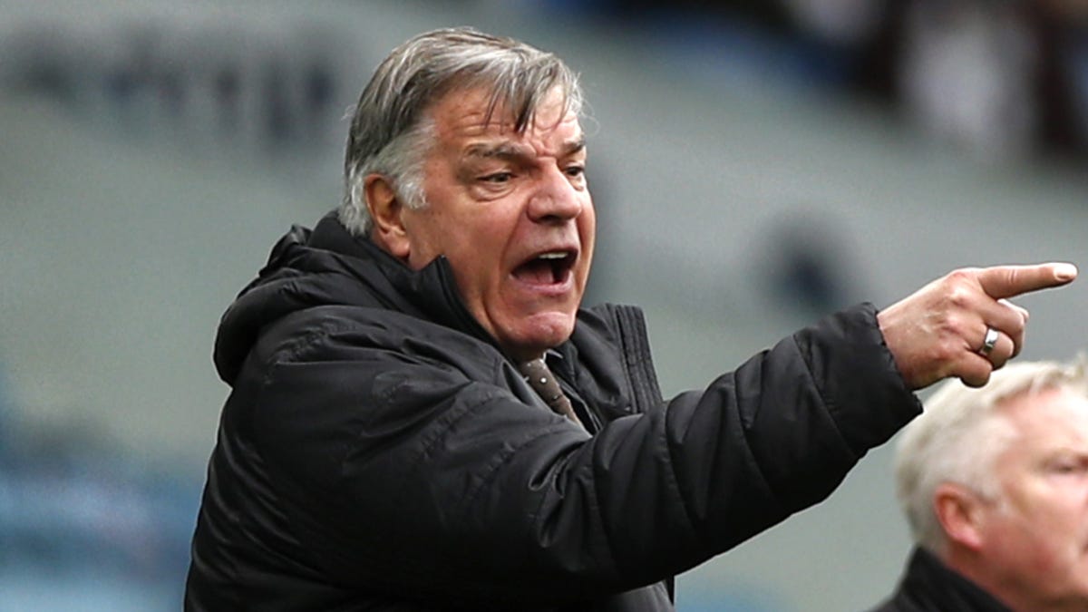 Soccer manager Sam Allardyce pointing to the right.