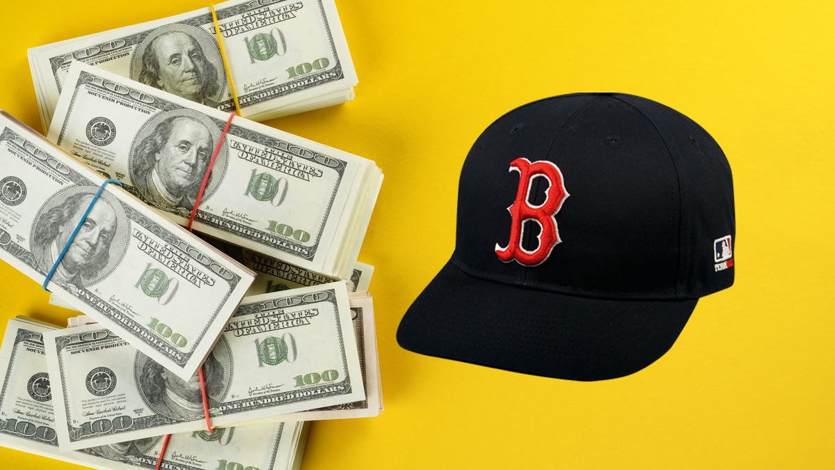 stack of cash with Boston Red Sox cap