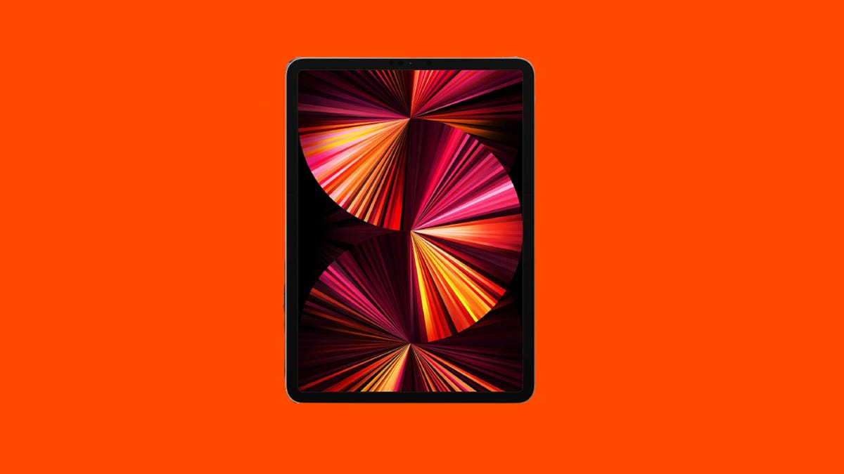 An iPad Pro against an orange background.