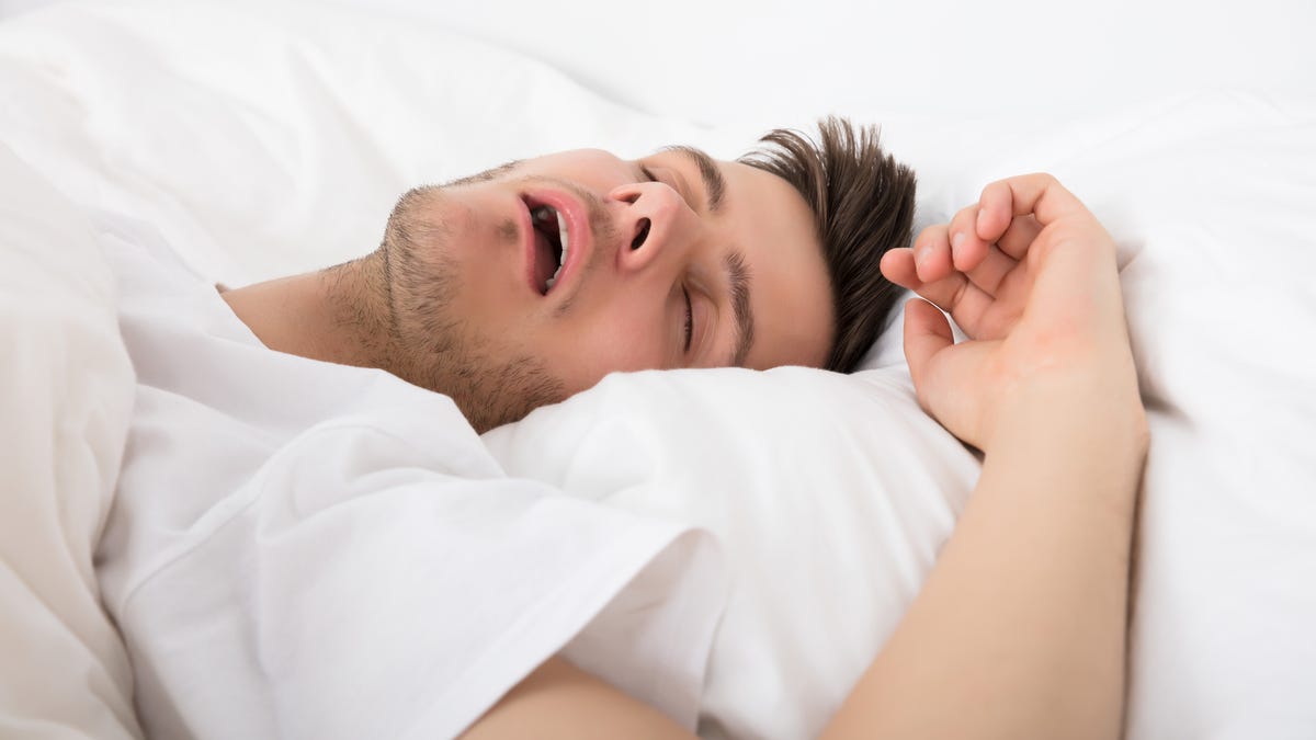 Young man snoring while sleeping