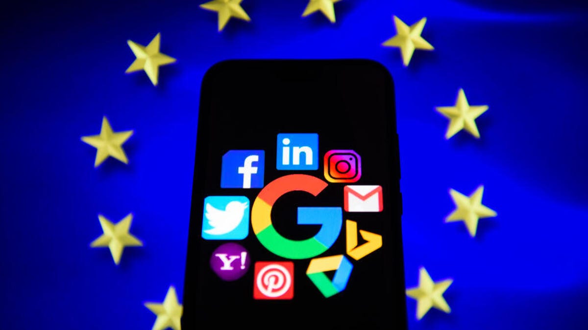 Phone featuring social media logos on top of EU flag