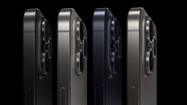 Side view of four iPhone 15 Pro devices