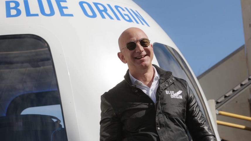 Bezos rockets to space, Tesla launches self-driving subscription plan