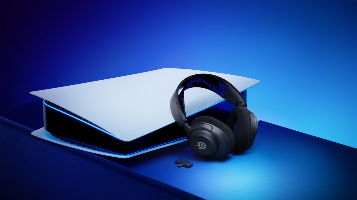 The Arctis Nova 4P leaning against a horizontally positioned PS5 with blue ambient illumination