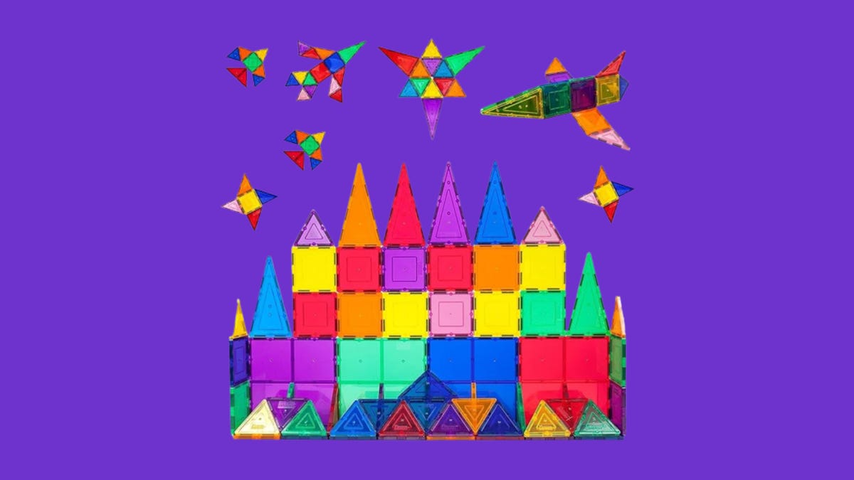 castle built of multicolor tiles on purple background