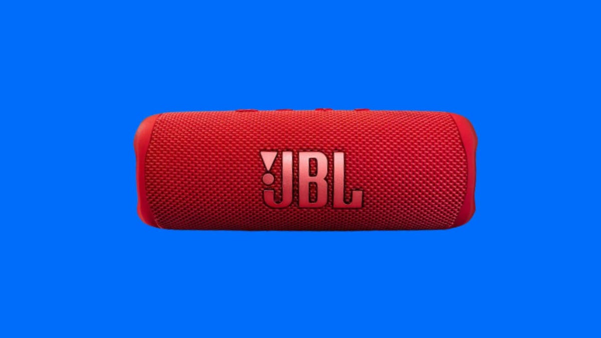 A red JBL speaker against a blue background.
