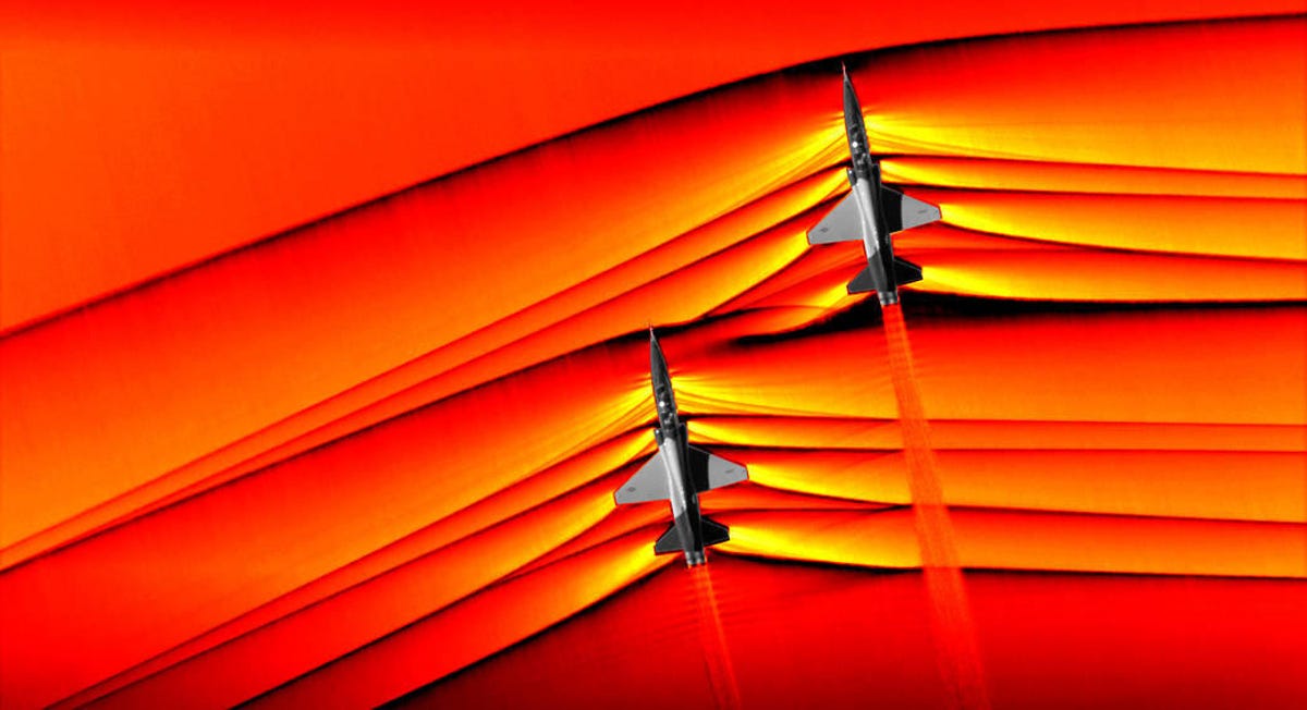 Schlieren imagery showing the shockwaves coming off two T-38 fighter jets midflight.