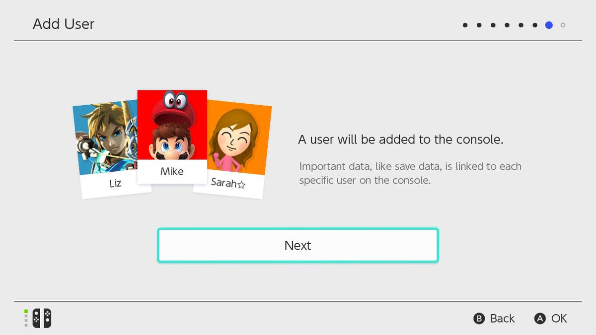 Switch OLED "Add User" screen: "A user will be added to the console. Important data, like save data, is linked to each specific user on the console." with three user photos