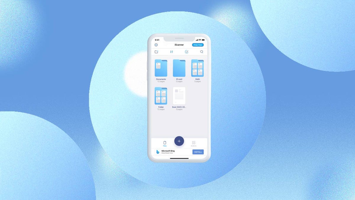 The iScanner app is displayed on a phone screen against a blue background.