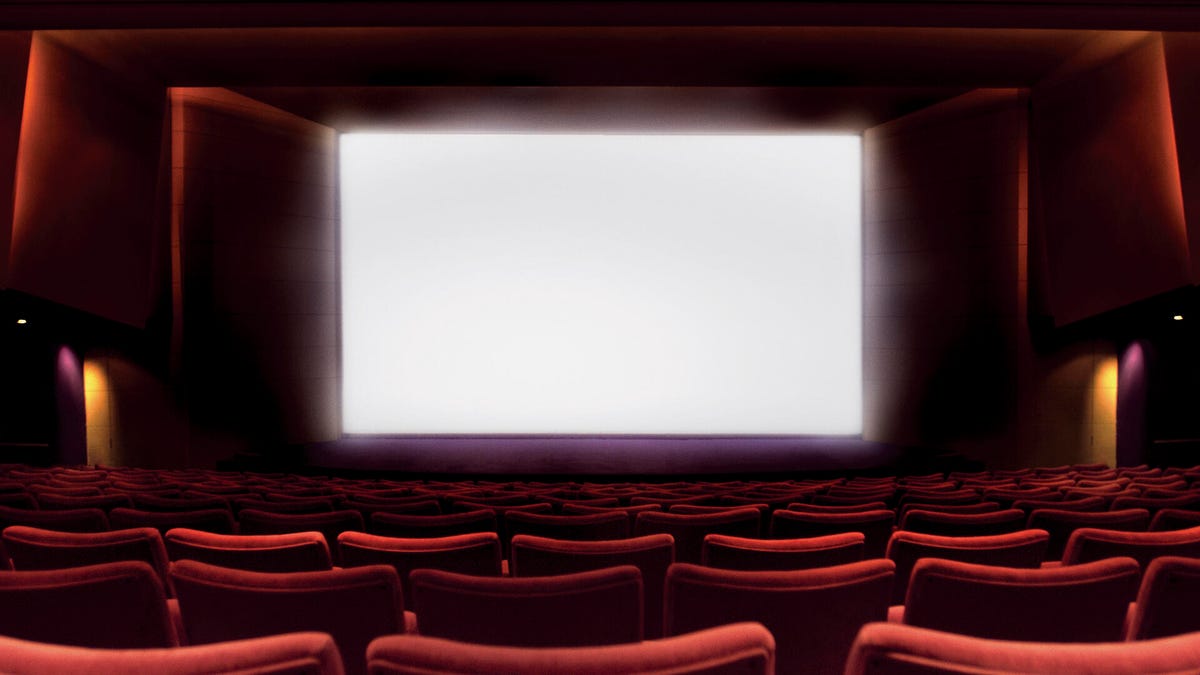 A movie theater with a blank screen.