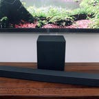 sound bar and subwoofer in front of TV