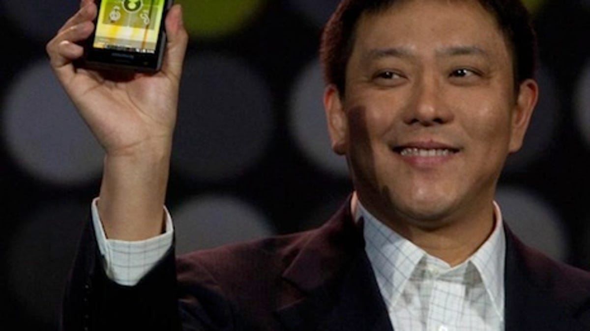 Liu Jun of Lenovo holding up the K800, Lenovo's first Intel-powered smartphone, at CES 2012.