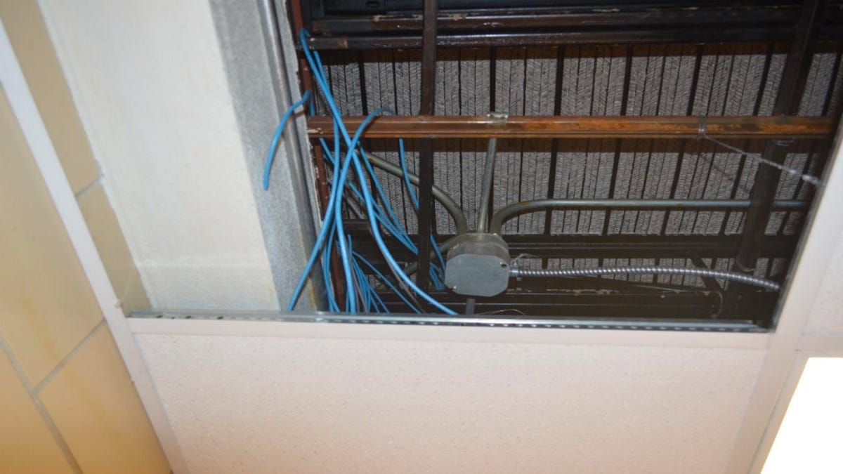 Inmates stashed their do-it-yourself PCs above a ceiling panel.