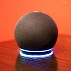 Amazon echo dot speaker with lights on showing Alexa command activation