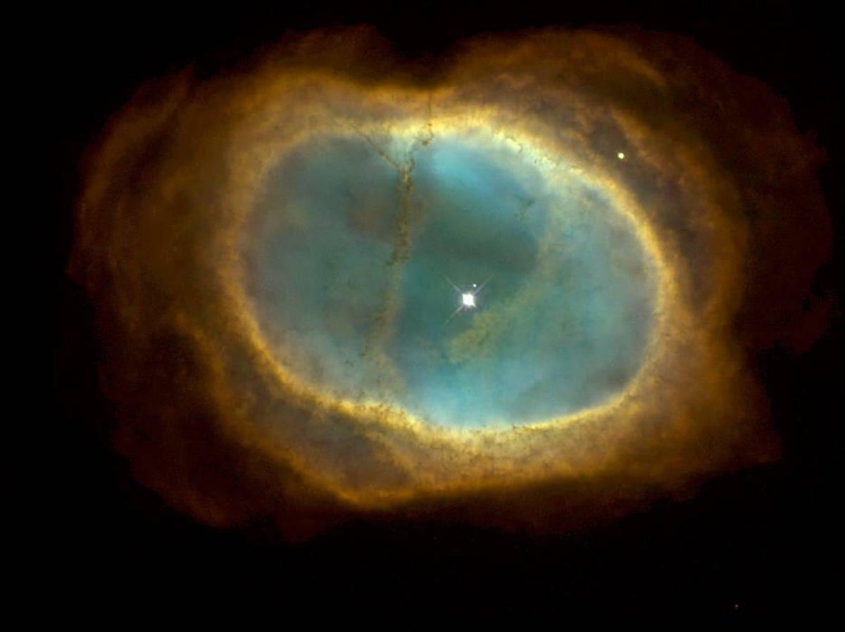The southern ring nebula in shades of turquoise and yellow