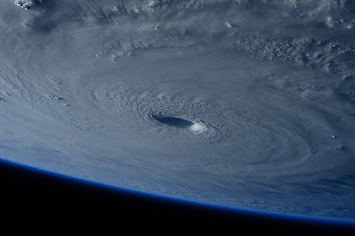 Typhoon Maysak seen from space looks like a giant white cloudy circle with a dark center.