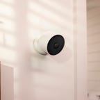 A Google Nest Cam mounted on an indoor wall.