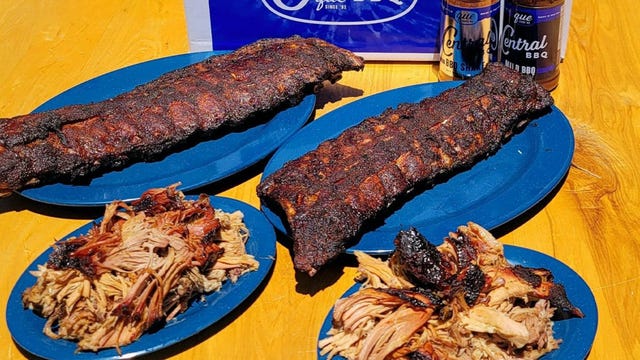 two slabs of ribs and two plates of pulled pork