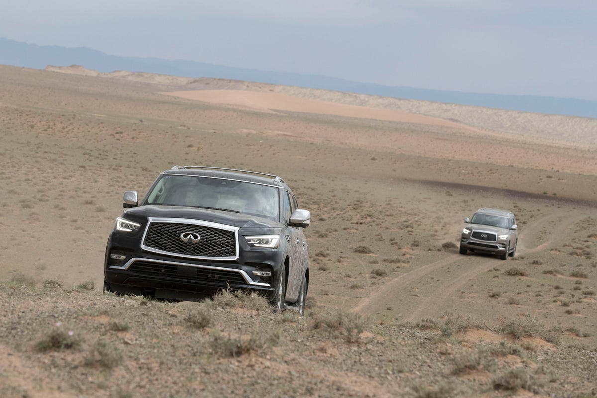Infiniti SUVs in the Gobi Desert