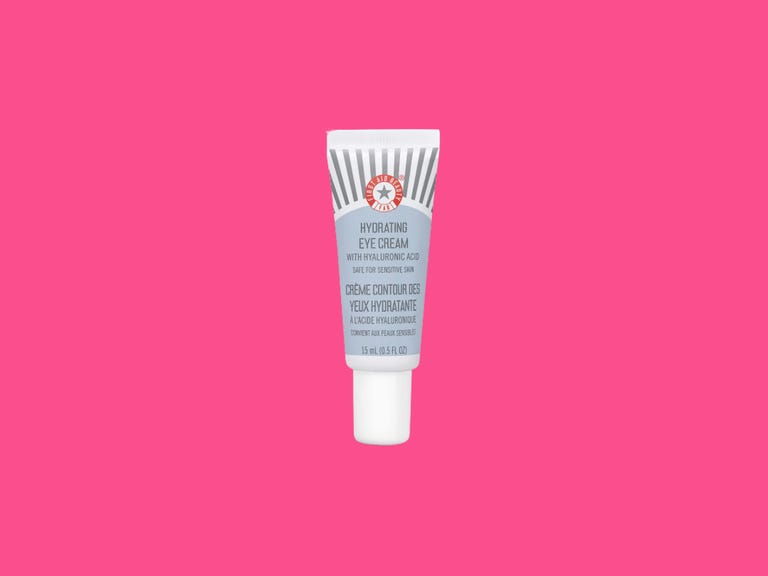First Aid Beauty Hydrating Eye Cream on colorful background.