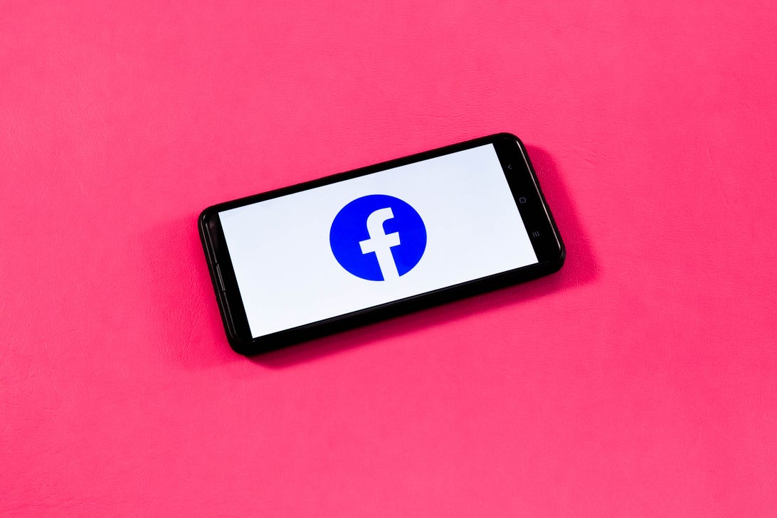 Facebook logo on a phone screen