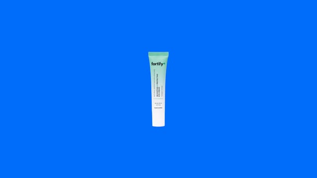 Fortify De-Puffing and Protecting eye cream on colorful background.