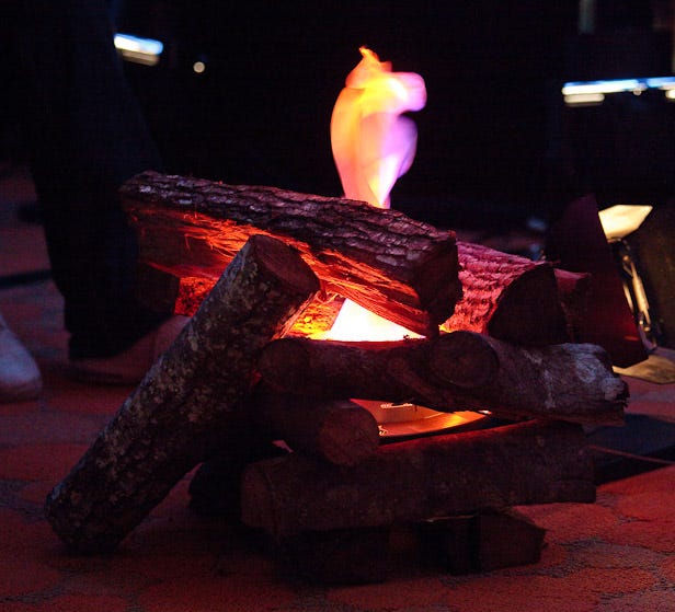 Rain forced Campfire One indoors and morphed real bonfires into these faux electric flames.