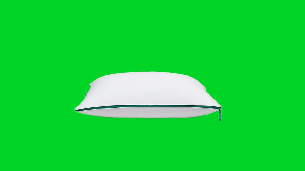 A Marlow pillow on a green background